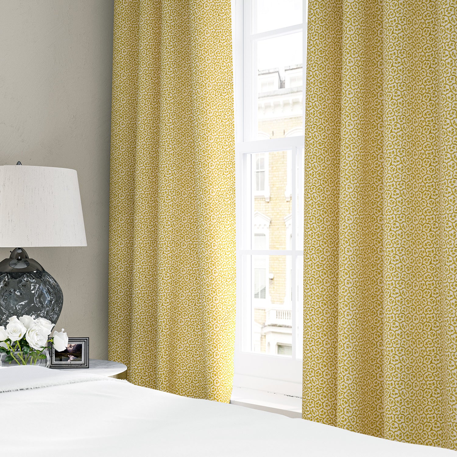 Linen curtains with a block print pattern in yellow and cream