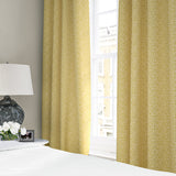 Linen curtains with a block print pattern in yellow and cream