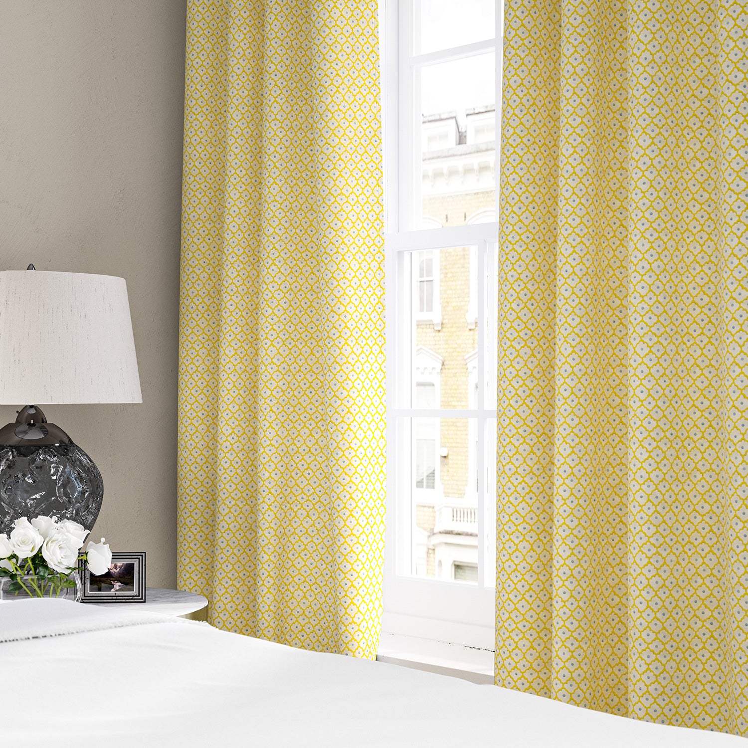 Linen curtains with a classic trellis design in blue, yellow, and cream