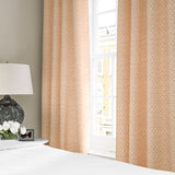 Linen curtains with a classic trellis design in pink, yellow, and cream