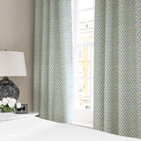 Linen curtains with a classic trellis design in blue, yellow, and cream.