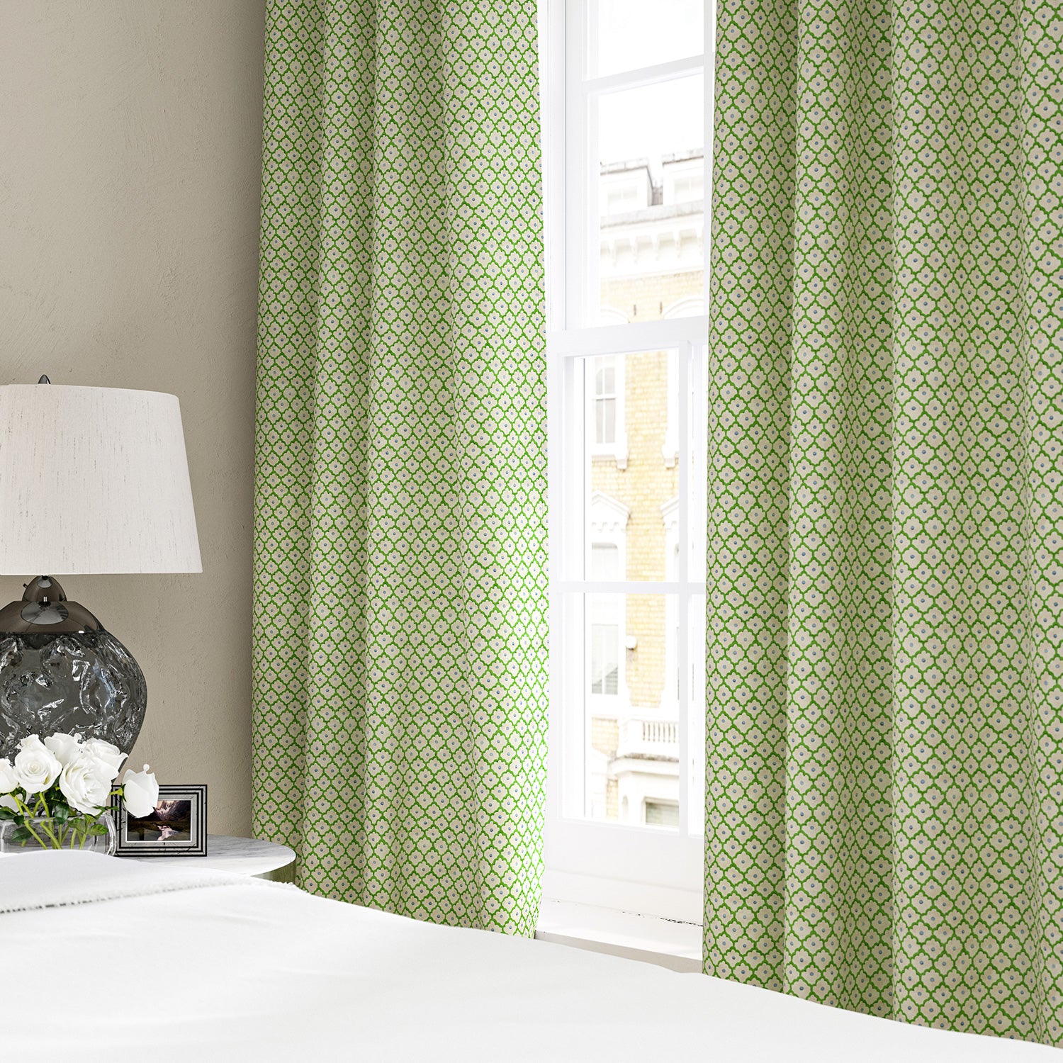 Linen curtains with a classic trellis design in blue, green, and cream