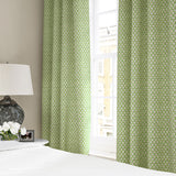 Linen curtains with a classic trellis design in blue, green, and cream