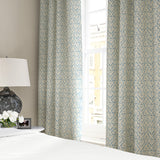 Linen curtains with a hand drawn; mirrored leaf motif pattern in blue and cream