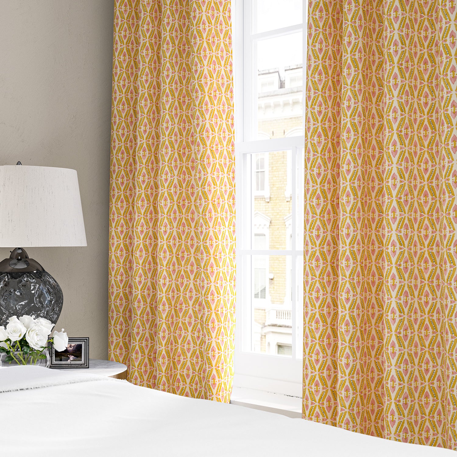 Linen curtains with a geometric design in pink, yellow and blue
