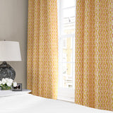 Linen curtains with a geometric design in pink, yellow and blue