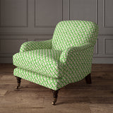 Printed linen fabric - a contemporary lattice design in green, cream and white – on an armchair