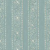 Printed linen fabric sample – a delicate pattern of moons and star-like dots in blue and cream