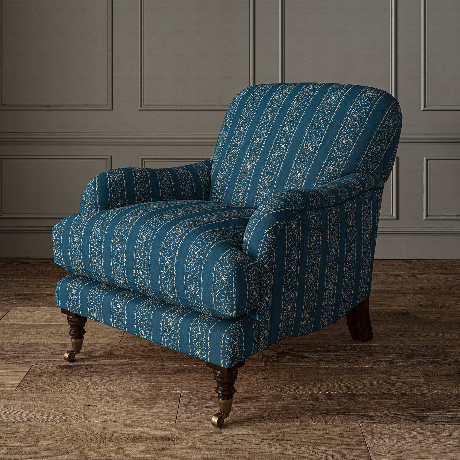Printed linen fabric – a delicate pattern of moons and star-like dots in blue and cream – on an armchair