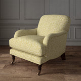 Printed linen fabric – damask-style pattern in yellow and cream – on an armchair