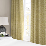 Linen curtains with a damask-style pattern in yellow and cream