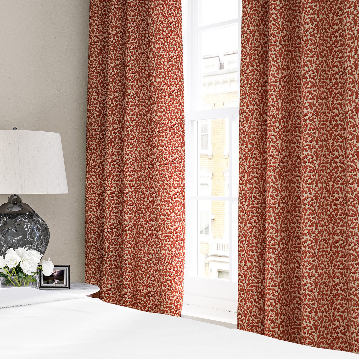 Linen curtains with a damask-style pattern in red and cream