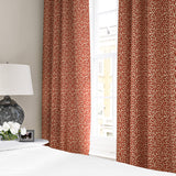 Linen curtains with a damask-style pattern in red and cream