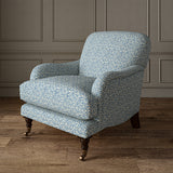 Printed linen fabric – damask-style pattern in blue and cream – on an armchair