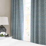 Linen curtains with a damask-style pattern in blue and cream