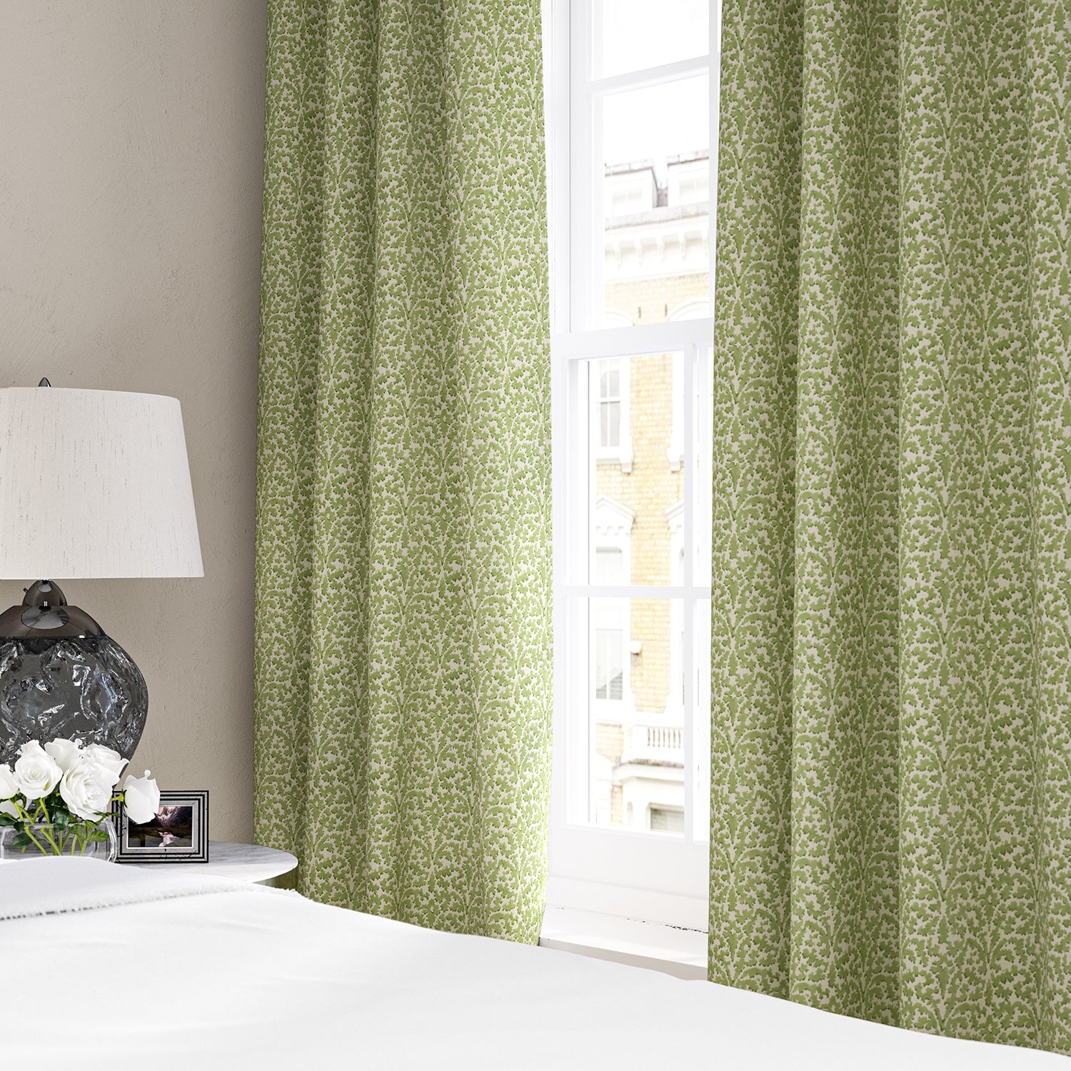 Linen curtains with a damask-style pattern in green and cream