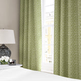 Linen curtains with a damask-style pattern in green and cream