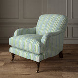 Printed linen fabric - a fresh band of jolly colours in blue, green and cream – on an armchair