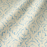 Printed linen fabric sample – a hand drawn; mirrored leaf motif pattern in blue and cream