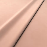 Fabric swatch of a pink velvet upholstery fabric