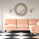 Sofa upholstered in a pink velvet upholstery fabric