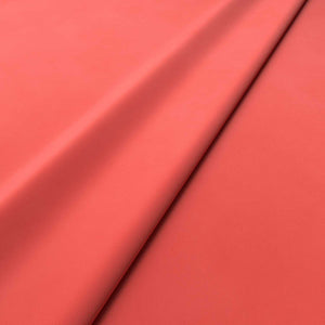 Fabric swatch of a pink velvet upholstery fabric