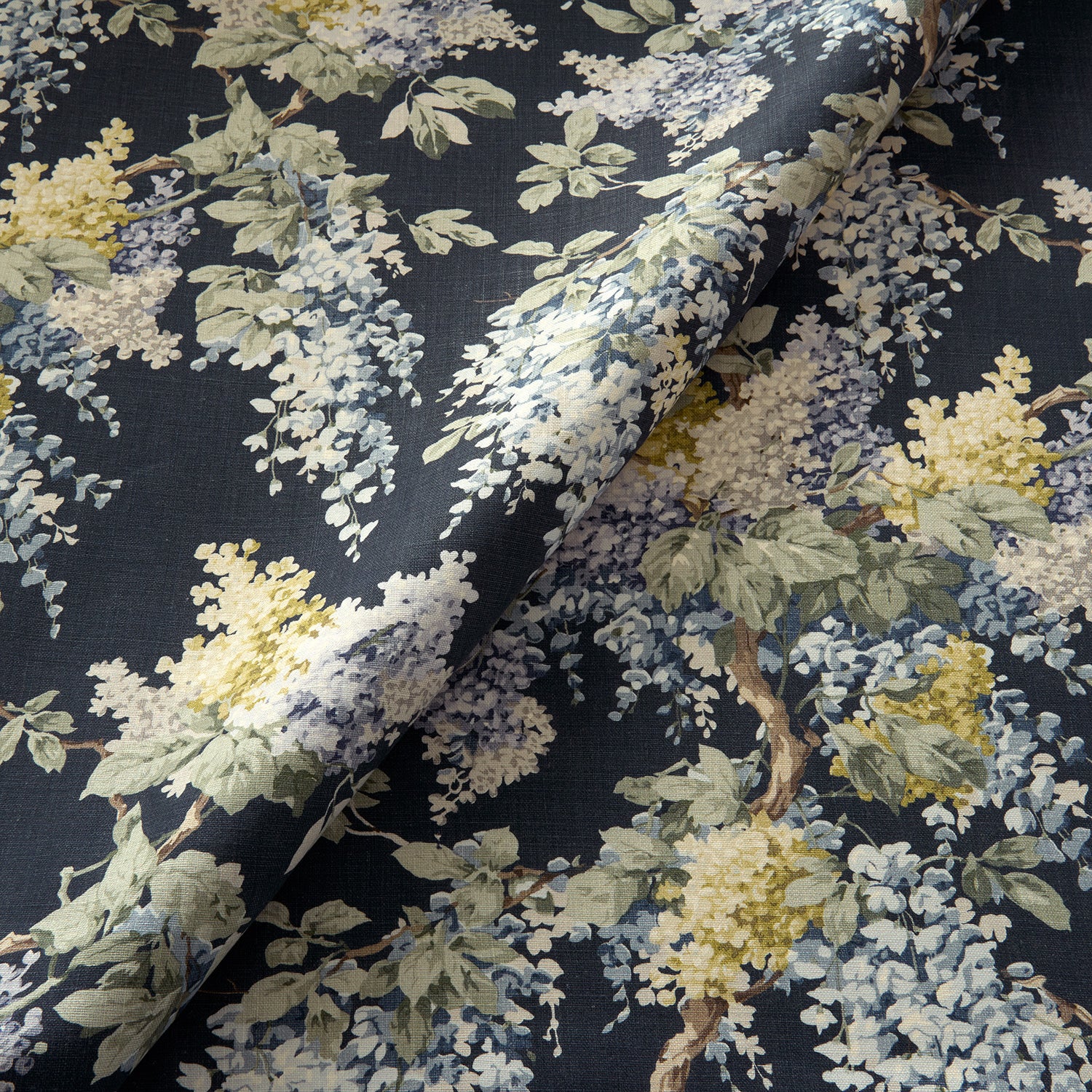 Printed linen fabric with wisteria floral pattern in blue and green colours for linen curtains, blinds and upholstery.