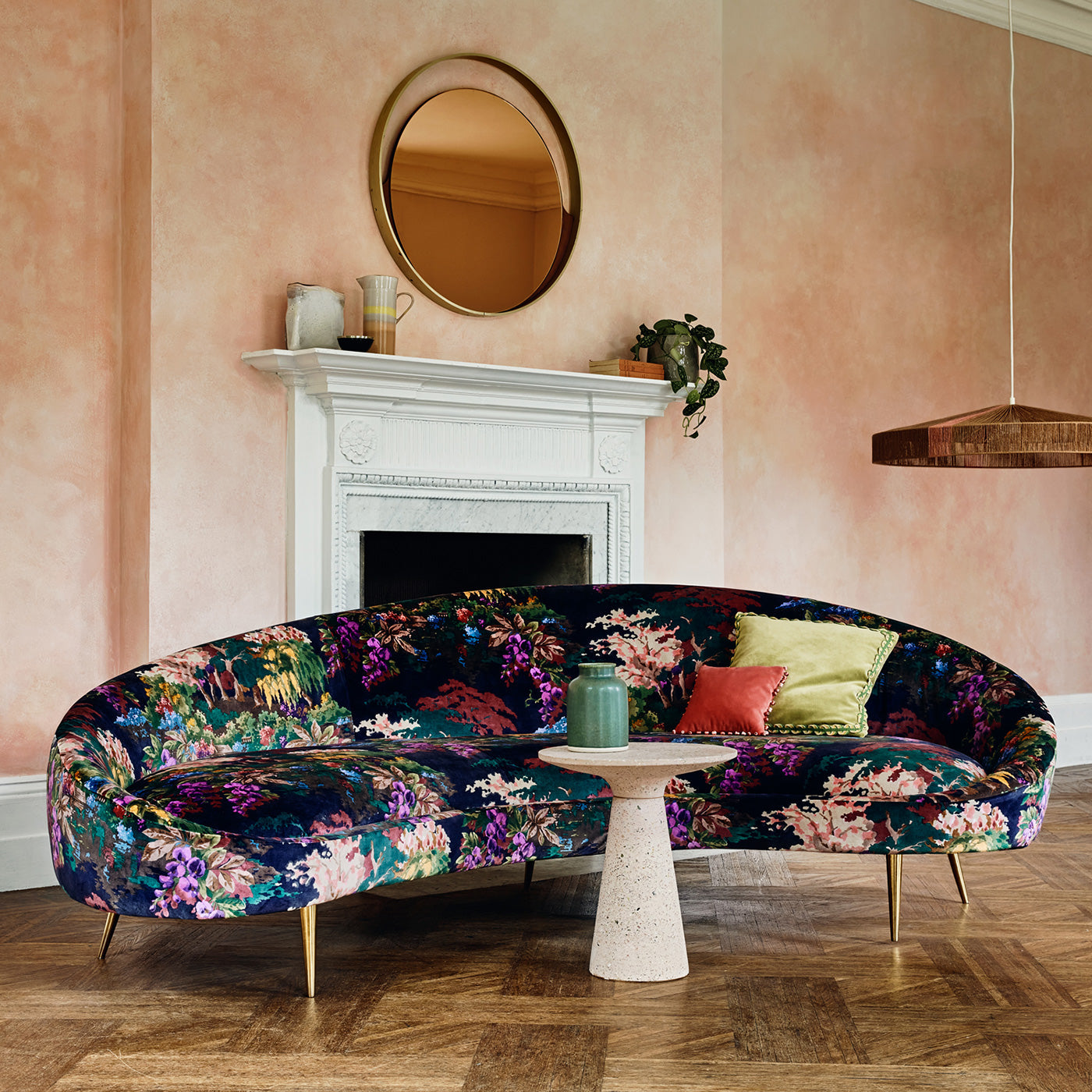Sofa in printed velvet fabric with ornamental garden scenic design in multicolours.
