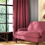 Living room featuring a sofa and curtains in a plain pink eco-friendly fabric