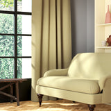 Living room featuring a sofa and curtains in a plain pastel yellow eco-friendly fabric