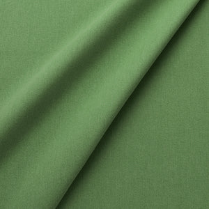 Fabric swatch of a eco-friendly plain green fabric for curtains and upholstery
