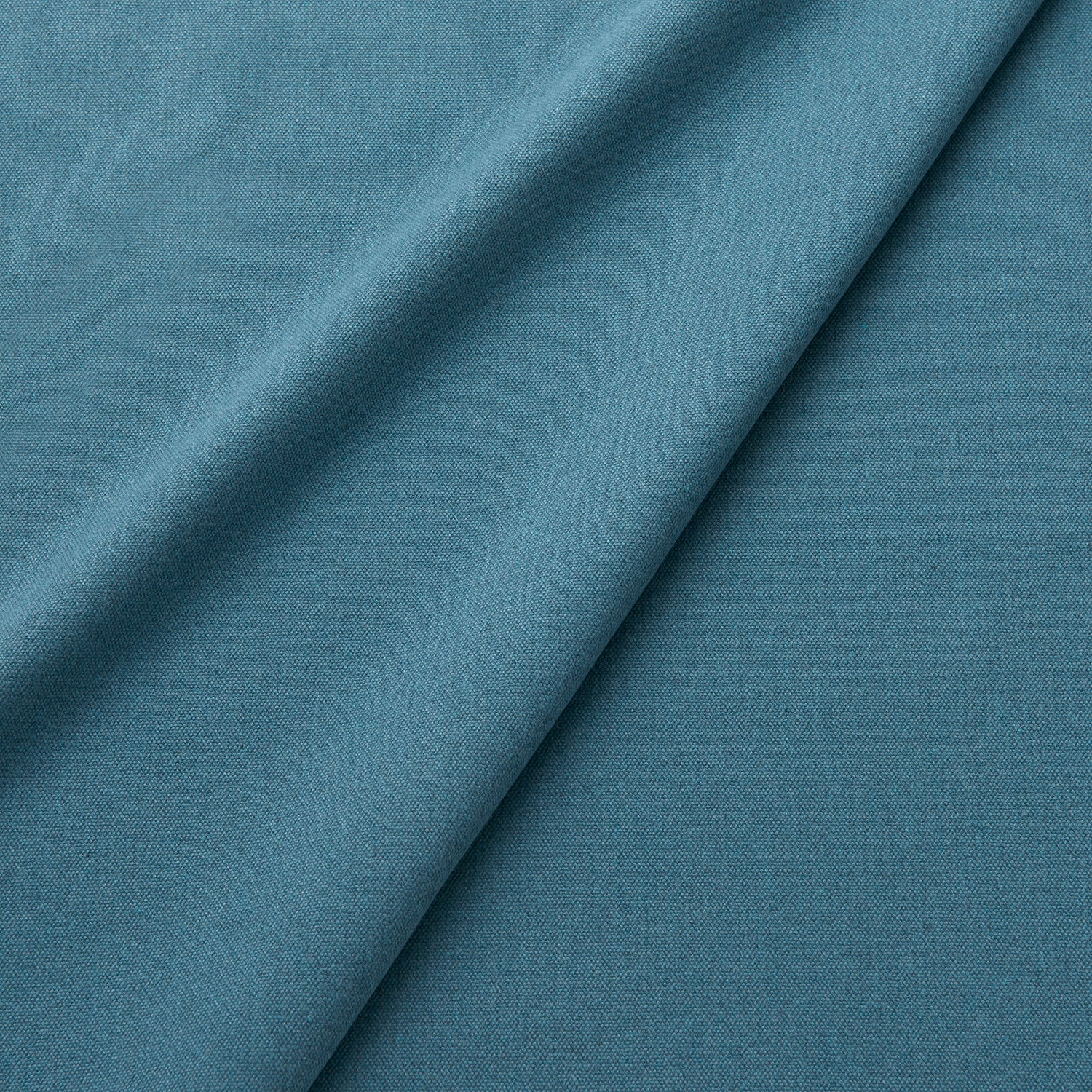 Fabric swatch of a eco-friendly plain blue fabric for curtains and upholstery