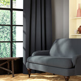 Living room featuring a sofa and curtains in a plain grey eco-friendly fabric