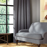Living room featuring a sofa and curtains in a plain grey eco-friendly fabric