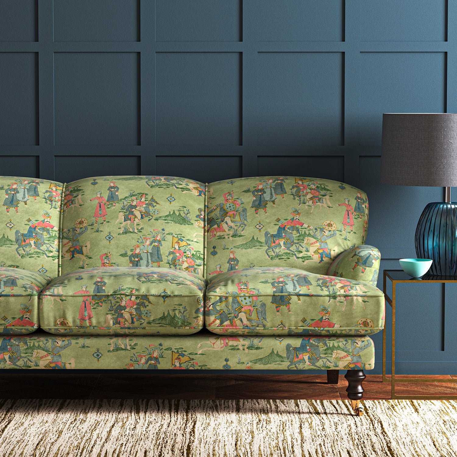 A printed velvet fabric showcasing lively horses and bedecked warriors in green on a sofa
