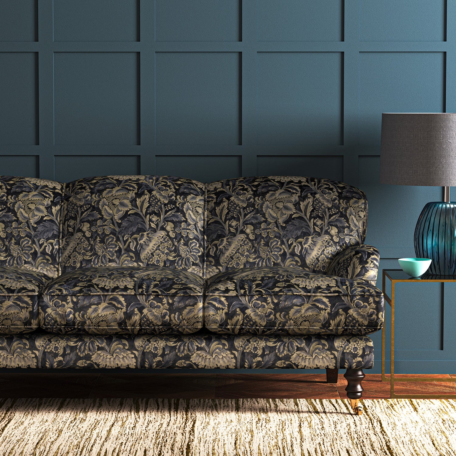 A printed velvet fabric showcasing an archival document, circa 1700s, this stylised floral is lavish, graceful, and timeless in blue on a sofa