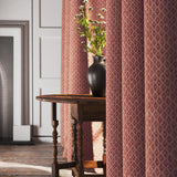 Curtain in a red and neutral printed linen fabric with a geometric pattern