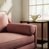 Sofa upholstered a red and neutral printed linen fabric with a geometric pattern