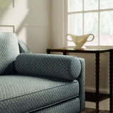 Sofa upholstered in a blue and neutral printed linen fabric with a geometric pattern