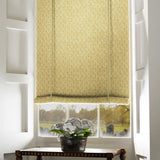 Blind in a yellow and neutral printed linen fabric with a geometric pattern
