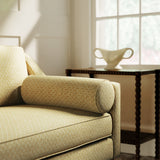 Sofa upholstered in a yellow and neutral printed linen fabric with a geometric pattern