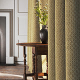 Curtains in a yellow and neutral printed linen fabric with a geometric pattern