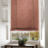 Blind in a red and neutral printed linen fabric with a geometric pattern
