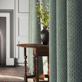 Curtains in a blue and neutral printed linen fabric with a geometric pattern