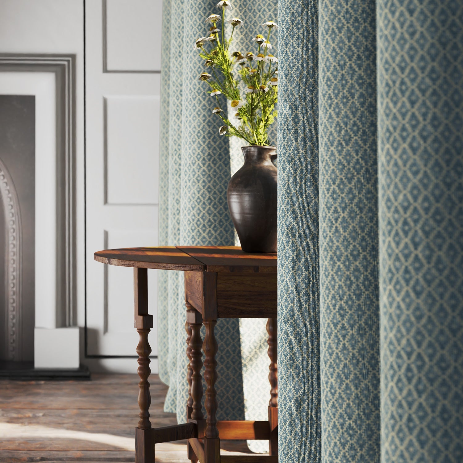 Curtains in blue and neutral printed linen fabric with a geometric pattern