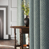 Curtains in blue and neutral printed linen fabric with a geometric pattern