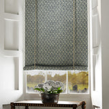 Blind in a blue and neutral printed linen fabric with a geometric pattern