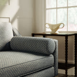 Sofa upholstered in a blue and neutral printed linen fabric with a geometric pattern
