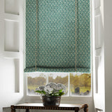 Blind in a blue and neutral printed linen fabric with a geometric pattern