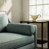 Sofa upholstered in a blue and neutral printed linen fabric with a geometric pattern